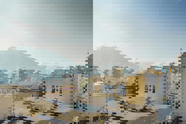 Parking Garage Redevelopment to Add Affordable Housing, Shops, and Rooftop Park